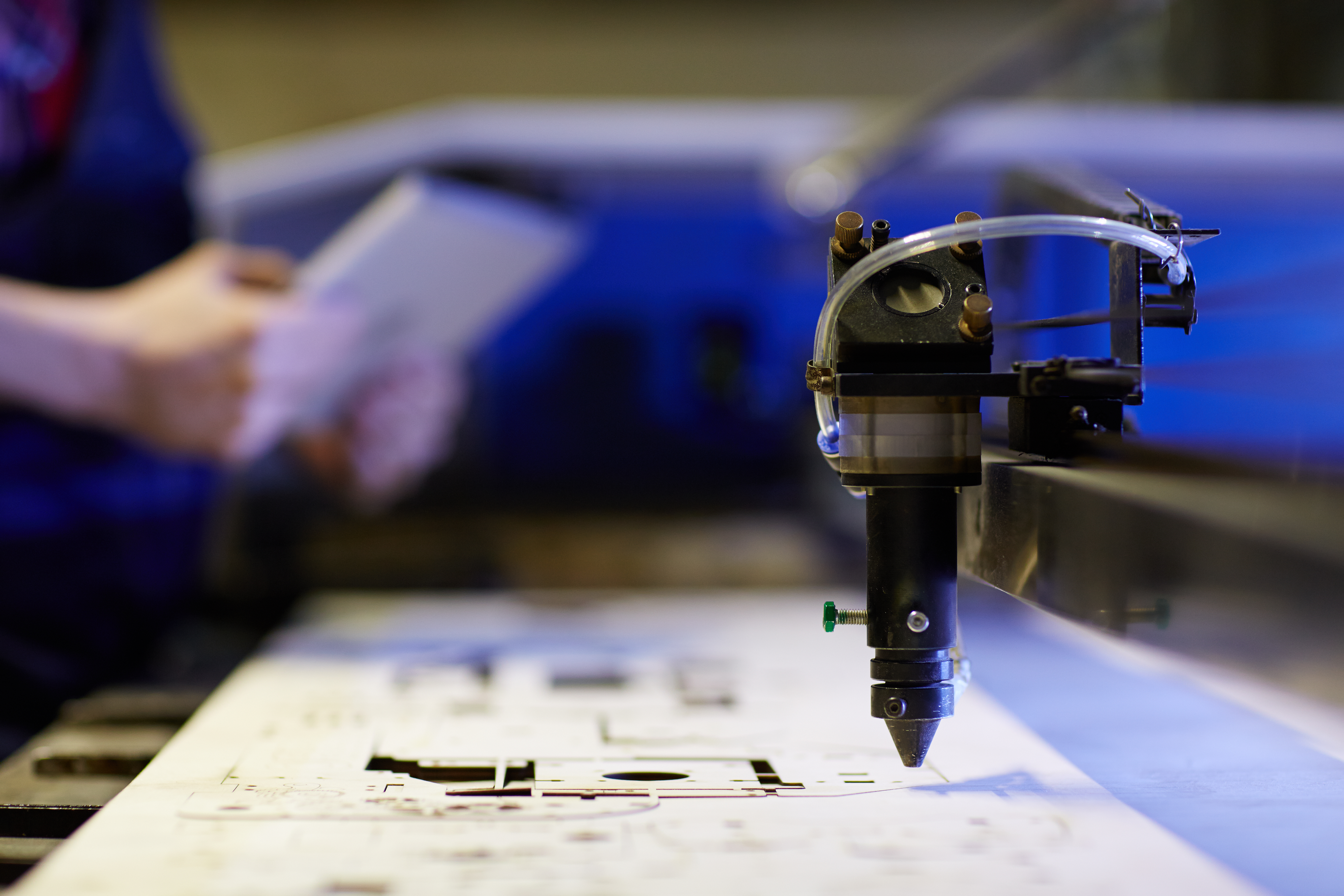 Laser cutting machine with blue light in operation